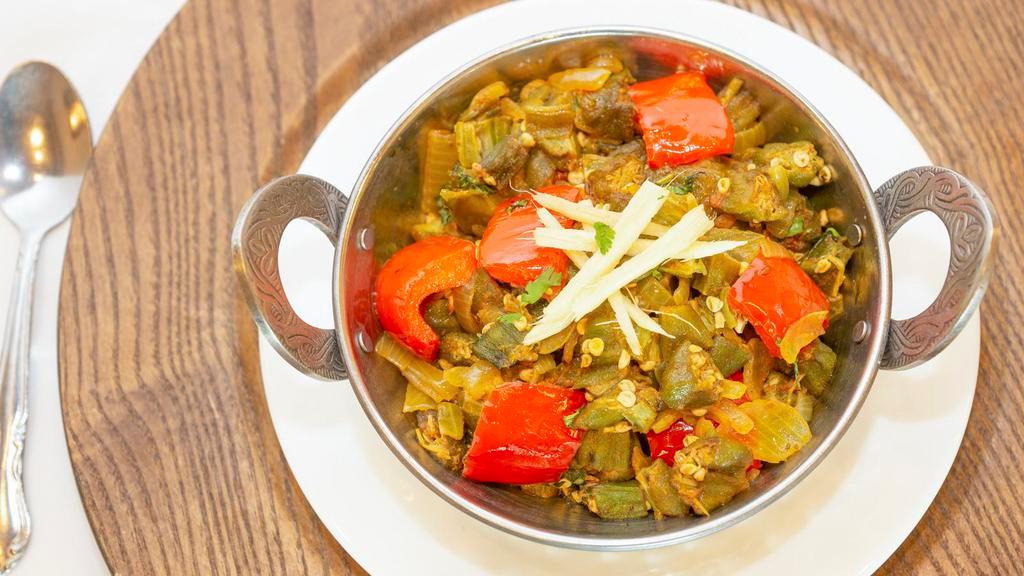 Bhindi Masala ( Vegan ) · Okra sautéed with onions, tomatoes, and spices.