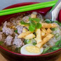 Sukothai · Rice noodles, seasoned ground pork, cilantro, peanuts, green beans, and hard-boiled egg in a...