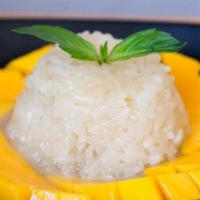 Mango With Sweet Sticky Rice · Fresh sliced mango and sweet sticky rice and a deliciously sauce on top