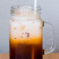 Thai Iced Tea · Classic iced Thai tea with a splash of half and half.