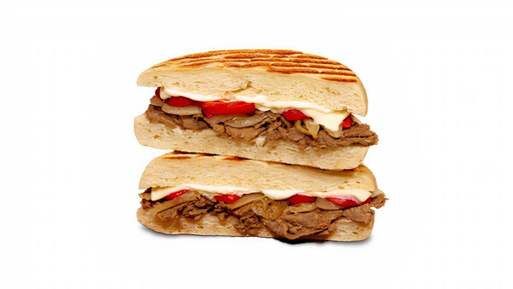 Cheese Steak Panini · shaved steak, mayo, american cheese, roasted onions, roasted red peppers