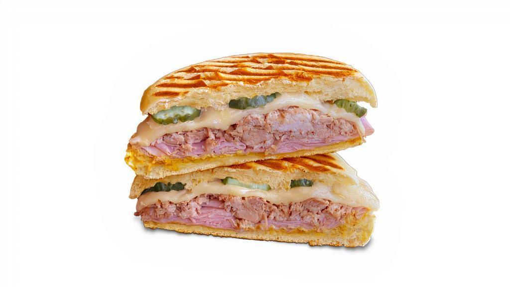 Cubano Panini · pulled pork, shaved ham, spicy mustard, swiss cheese, pickles