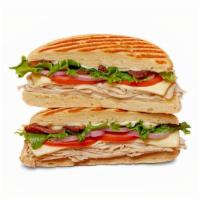 Turkey Club Panini · shaved turkey, crumbled bacon, mayo, american cheese, lettuce, red onions, tomatoes