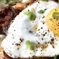 Loaded Poutine · Hand-cut fries, mozzarella cheese curds, crumbled  linguica, sunny side-up egg*, steak sauce
