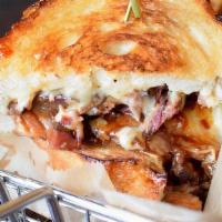 Brisket Grilled Cheese · Smoked beef brisket, cheddar and american cheese, with C&P BBQ sauce