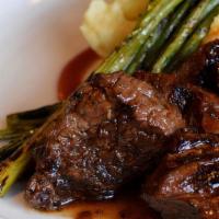 Bourbon Tips · Wood-grilled, marinated tenderloin tips garlic mashed potatoes, grilled asparagus, with a bo...