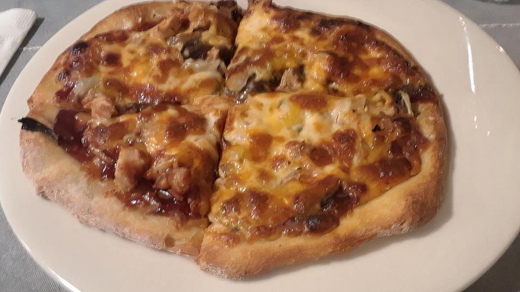 Bbq Chicken Pizza · Chicken, mushrooms, onions, cheddar cheese & mozzarella cheese with bbq sauce.