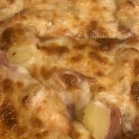 Hawaiian Chicken Pizza · Hawaiian sauce, chicken, pineapple & fresh parmesan cheese.