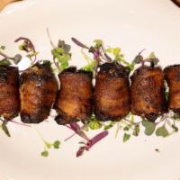 Bacon-Wrapped Dates · sweet medjool dates wrapped in bacon and stuffed with gorgonzola cheese