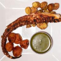 Broiled Octopus · broiled octopus tentacle, crispy red potato, roasted cherry tomato, lemon and herb gremolata