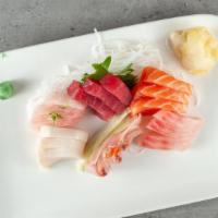 Sashimi Deluxe · 18 pieces of assorted sashimi. Served with white rice.