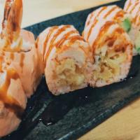 Volcano Roll · 10 pieces crab avocado and cream cheese, deep fried, with baked crab meat on top.