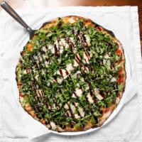 The Marley · Tomato sauce, mozzarella, topped with arugula, shaved parmesan, balsamic drizzle.