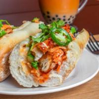 Sweet Chili Chicken Bánh Mì · Crispy white meat chicken tenders glazed in our sweet chili sauce, viet mayo.