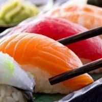 Salmon Sake Sashimi · Three pieces.