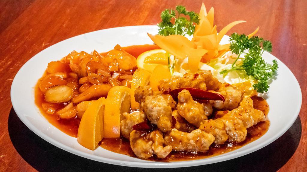 Dragon & Phoenix · Hot & Spicy. Two dishes in one, chunks of large jumbo shrimp in tomato sauce, and tender chicken breast deep fried in batter, sautéed in garlic sauce.
