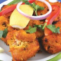 Fish Pakora · Deliciously marinated fish in lentil batter, deep-fried to a perfect crisp.