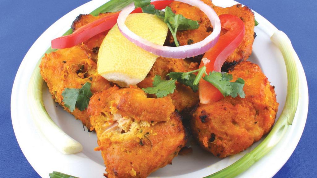 Fish Pakora · Deliciously marinated fish in lentil batter, deep-fried to a perfect crisp.