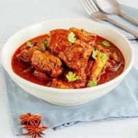 Lamb Vindaloo · Delicious and juicy boneless tender lamb pieces, cooked with potatoes in a spicy and tangy s...