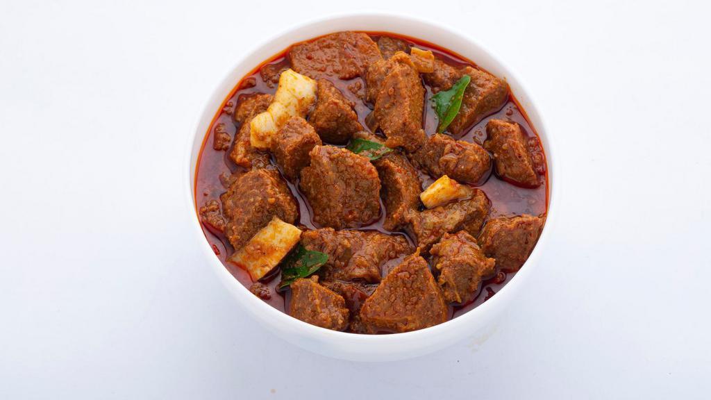 Lamb Korma · Delicious and juicy tender lamb pieces, in cardamoms flavored sweet and spicy cream with cashews and raisins.