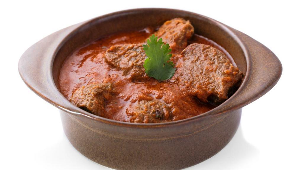 Bhuna Lamb · Delicious and juicy chunks of tender lamb pieces, cooked with tomatoes, onions, fresh herbs and spices. Served with a side of rice.