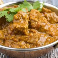 Shahi Lamb Korma · Delicious and juicy tender lamb pieces, cooked with creamy sauce, onions and tomatoes. Serve...
