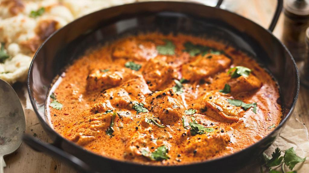 Chicken Dopiaza · Delicious boneless chicken, cooked with fresh onions, tomatoes, bell peppers and house spices.