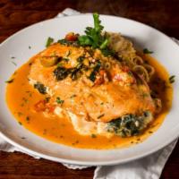 Stuffed Chicken Valdostana · Oven roasted chicken breast stuffed with fontina cheese, prosciutto and rugola. Served in a ...