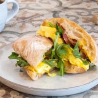 Breakfast Sandwich · Egg and cheese sandwich with arugula and choice of sauce on a ciabbatino roll. Meat addition...