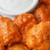 10 Piece Boneless · 10 of our boneless breaded wings with up to 2 of our 20+ sauces.  Comes with 1 dressing.  Ce...