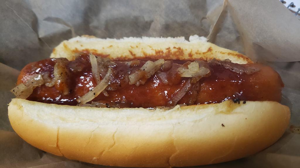 Brisket Dog Meal · Brisket burnt ends in the shape of a hot dog.  This is the best part of brisket in a tide tube so you can eat it with one hand.  Covered in our famous home made BBQ sauce and grilled onions on a toasted hot dog bun.  Comes with plain fries and a soda