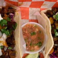 Tacos · Your choice of grilled meat: chicken, pork, steak, onions, cilantro, salsa.