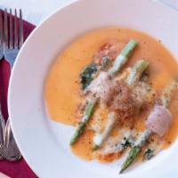 Asparagus Rollatini · Asparagus spears wrapped with spinach, prosciutto and mozzarella cheese.