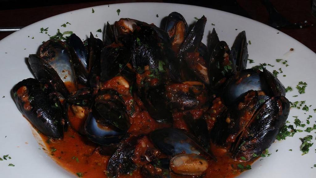 Mussels · Fresh mussels sautéed with garlic, white wine or a marinara sauce.