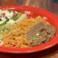 Enchilada · Three corn tortillas, choice of one filling, salsa verde, topped with melted cheese, side of...