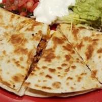 Quesadilla Patron · 12 inch Grilled flour tortilla, choice of one filling cheese, guac, pico, sour cream lettuce.
