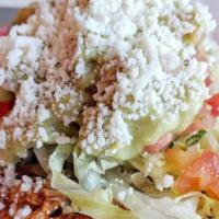 Tostada · Toasted corn tortilla, choice of one filling refried beans, pico, lettuce queso fresco, crem...