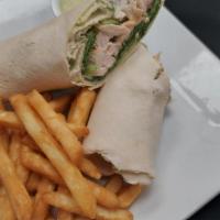 Chicken Caesar Wrap · Grilled chicken tossed with romaine lettuce, Caesar dressing, crushed croutons and parmesan ...