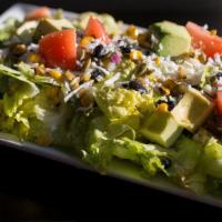 Chop Salad · Iceberg/romaine blend, roasted corn, black beans, tomato, red onion, pepitas, cucumbers, aco...