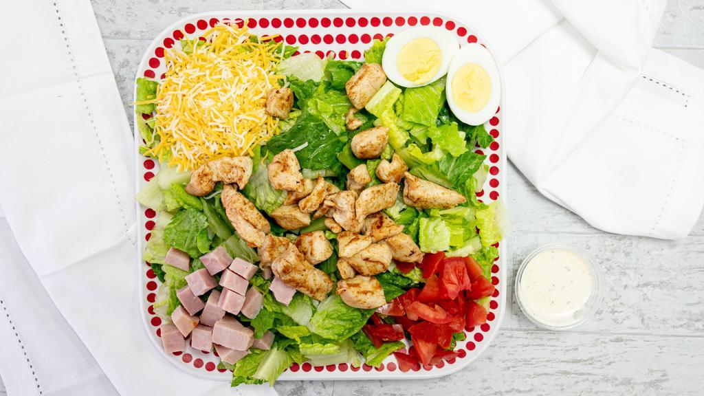 Chef Salad · romaine, grilled chicken, ham, tomato, hard-boiled egg & shredded cheese. Make it a cobb- add blue cheese, bacon, and avocado ranch dressing.