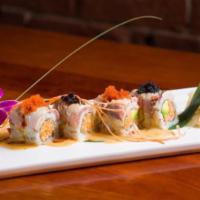 Dynamite Maki · Spicy cooked scallop and king crabmeat top with yellow tail, miso lemon dressing.
