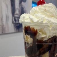 Brownie Sundae · 3 scoops vanilla warm brownie hot fudge whipped cream and a cherry.