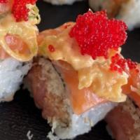 Umai · Crunchy spicy tuna roll topped with salmon, spicy yellowtail and tobiko.
