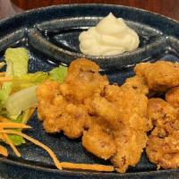 Karaage  · Deep-fried boneless chicken served with garlic mayo and a side of small salad.