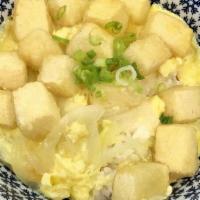 Tofu Tamago-Toji Don · Tofu and onions cooked with beaten eggs served one a bed of rice topped with green onions.