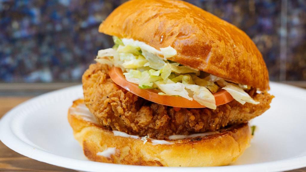 Carolina Classic Chicken Sandwich · buttermilk brined fried chicken, duke’s mayo, lettuce, tomato, on a soft roll