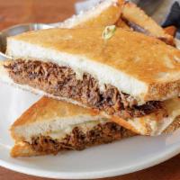 Beef Grilled Cheese · Griddled ciabatta with Cabot white cheddar, pulled braised beef, and au jus gravy.