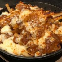 Poutine Fries · Crispy fries, turner's family onion gravy recipe, cheddar cheese curds.