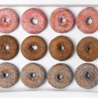 House Pick Of Hot Fresh Donuts · A selection of six or 12 of our daily hot fresh donuts - Cinnamon Brown Sugar, Strawberry La...