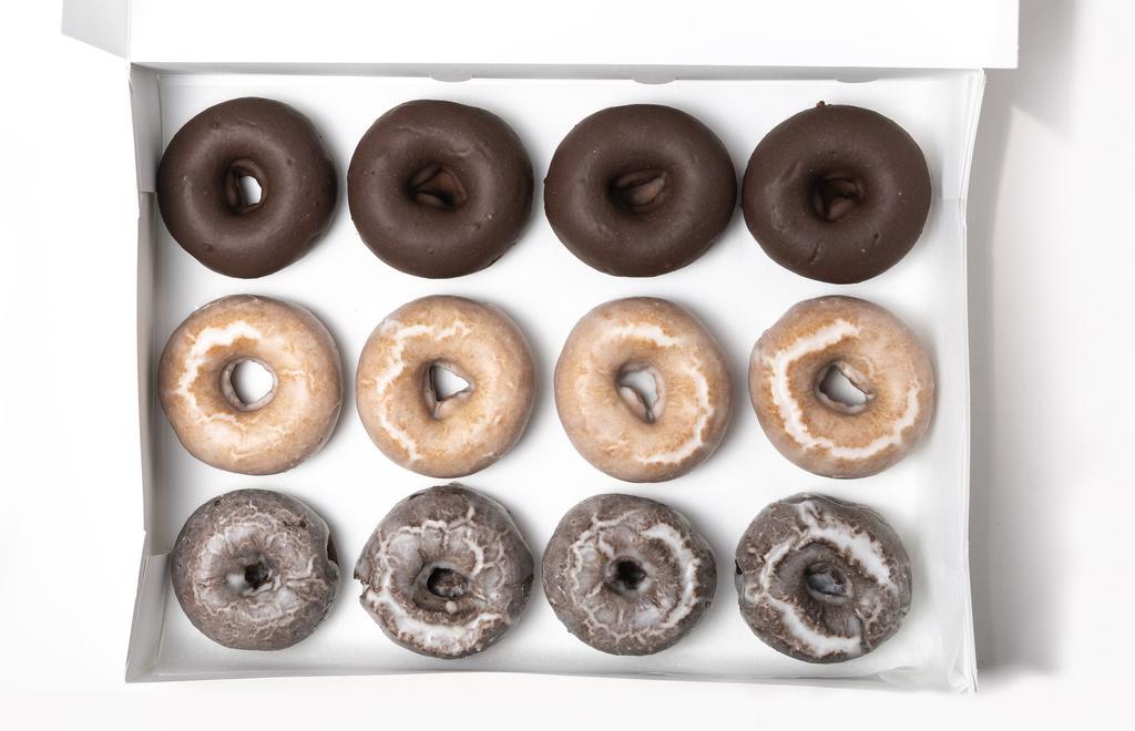 House Pick Of Classic Donuts · A selection of six or 12 of our daily classic simply-glazed donuts - Old Fashioned Glazed, Dark Chocolate Glazed, Chocolate Cake Old Fashioned.